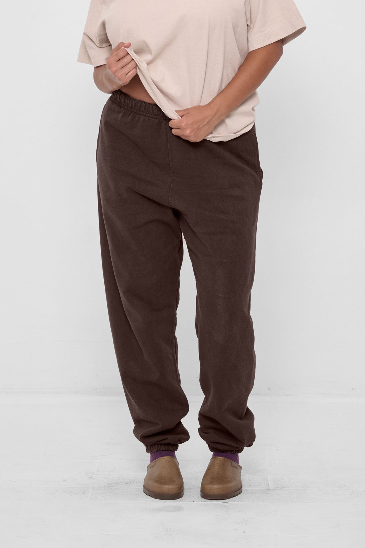 Trash Sweatpants in Wet Soil – front view on model