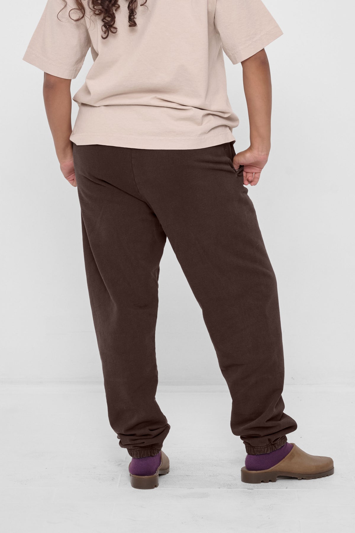 Trash Sweatpants in Wet Soil – back view on model