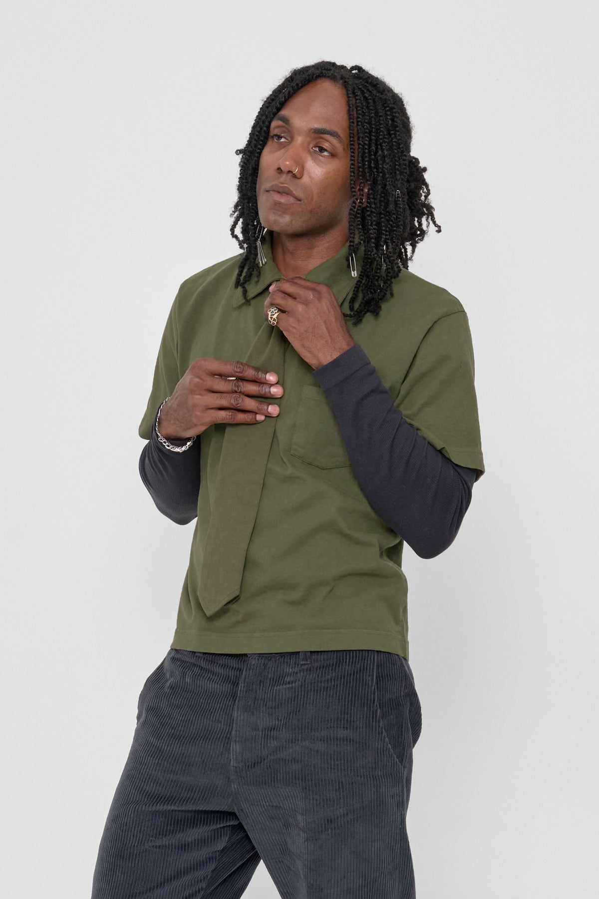 Trash Tie in Olive – on a model, 3/4 front view
