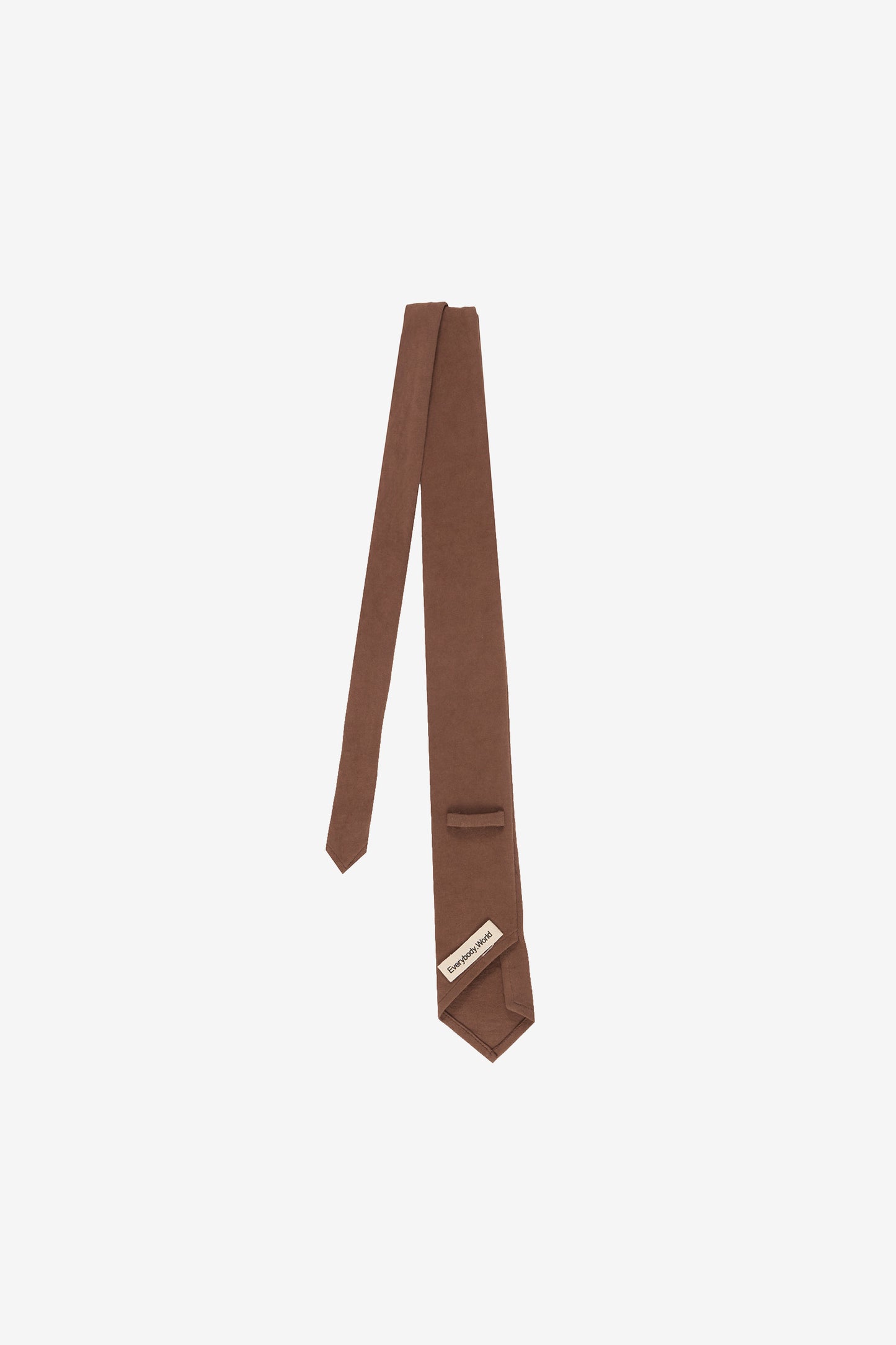 Back flat lay, showing loop ,tie folded in half and tag.