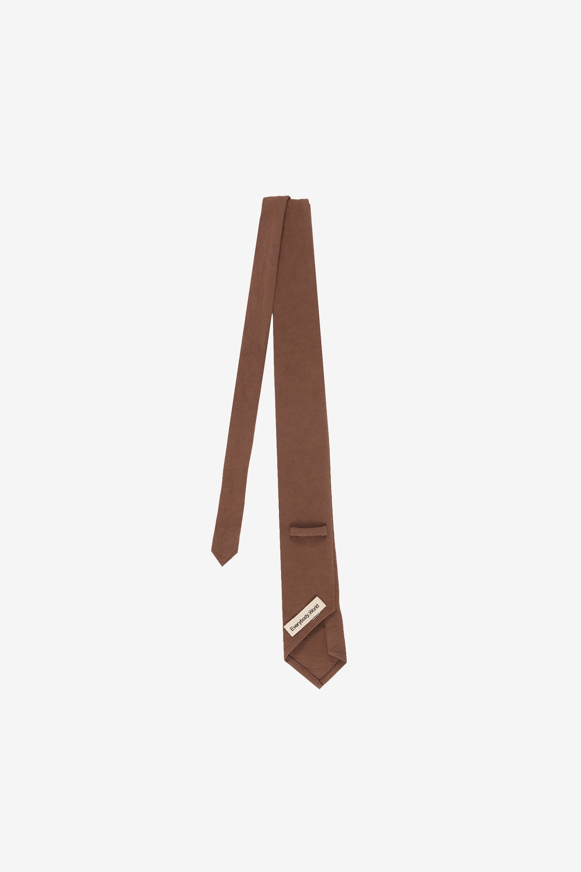 Back flat lay, showing loop ,tie folded in half and tag.