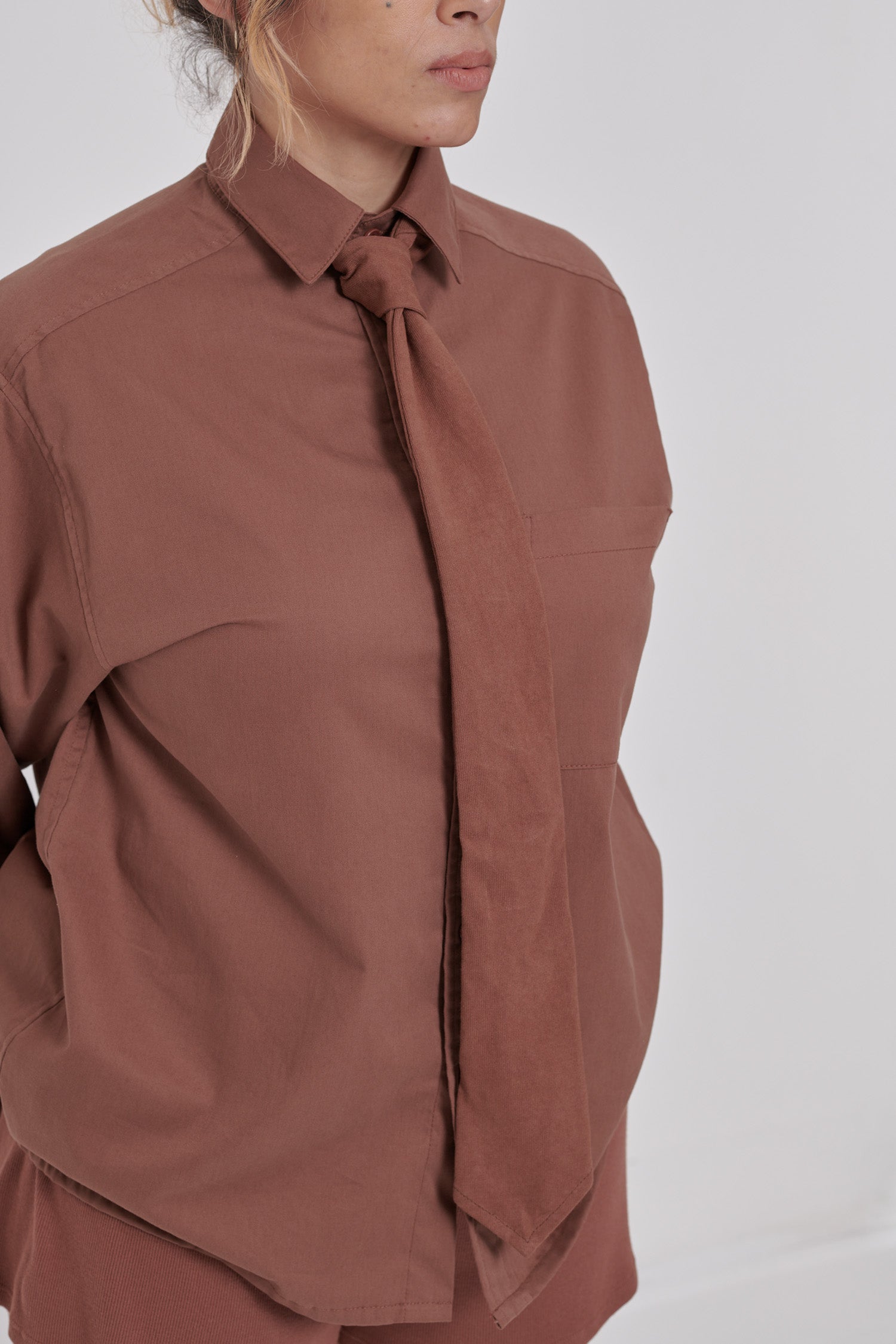 Close up detail of heavyweight trash tie fabric against lighter weight peach fuzz twill. 