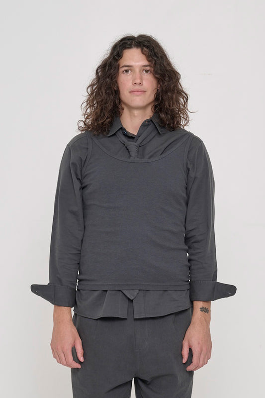 Person wearing Slate Trash Tie tucked into Slate Rib Tank over Slate Button-Up Shirt.