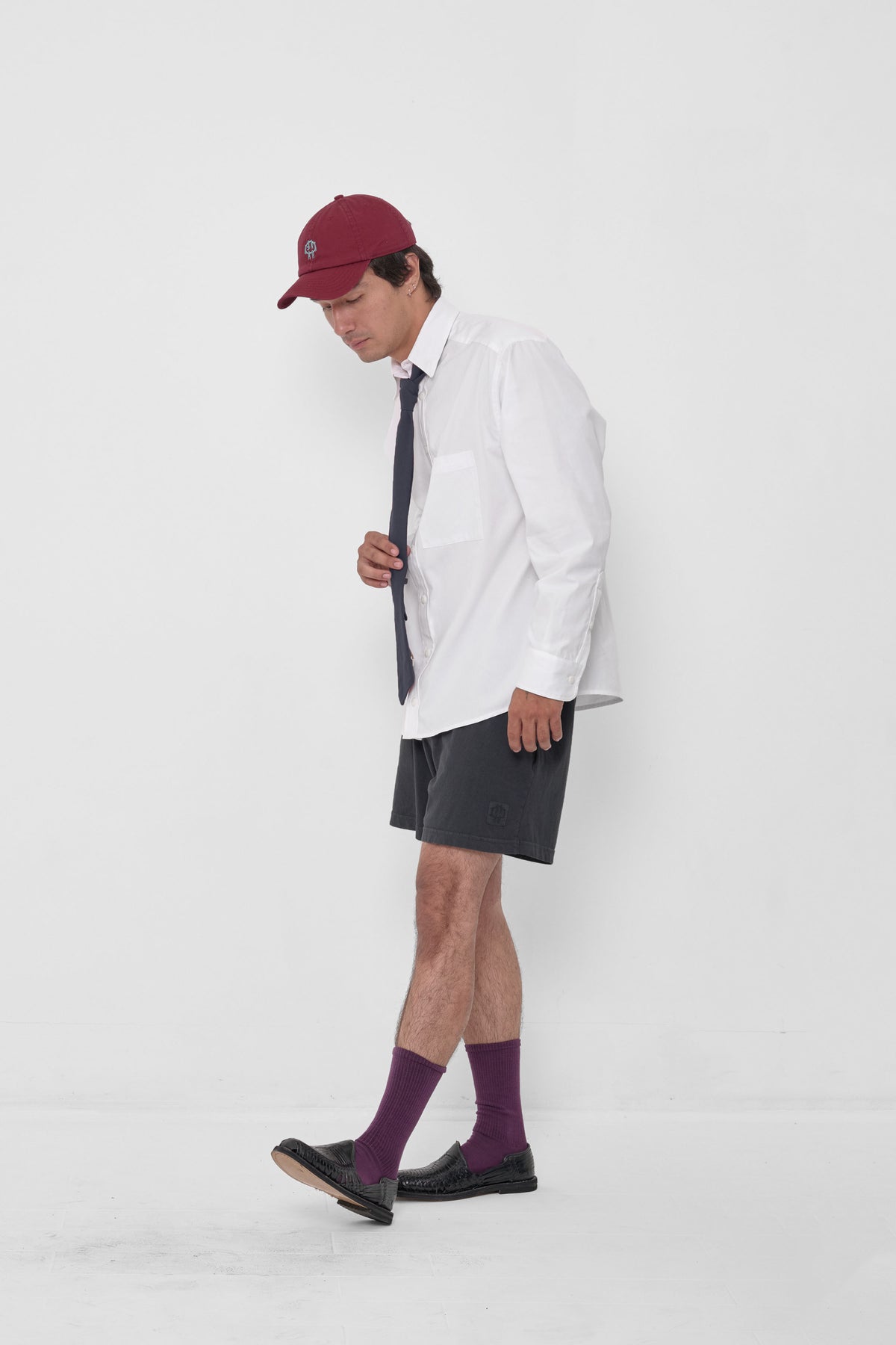 Trash Tie in Slate – on a model, tied around the collar of a White Peach Fuzz Button-Up Shirt