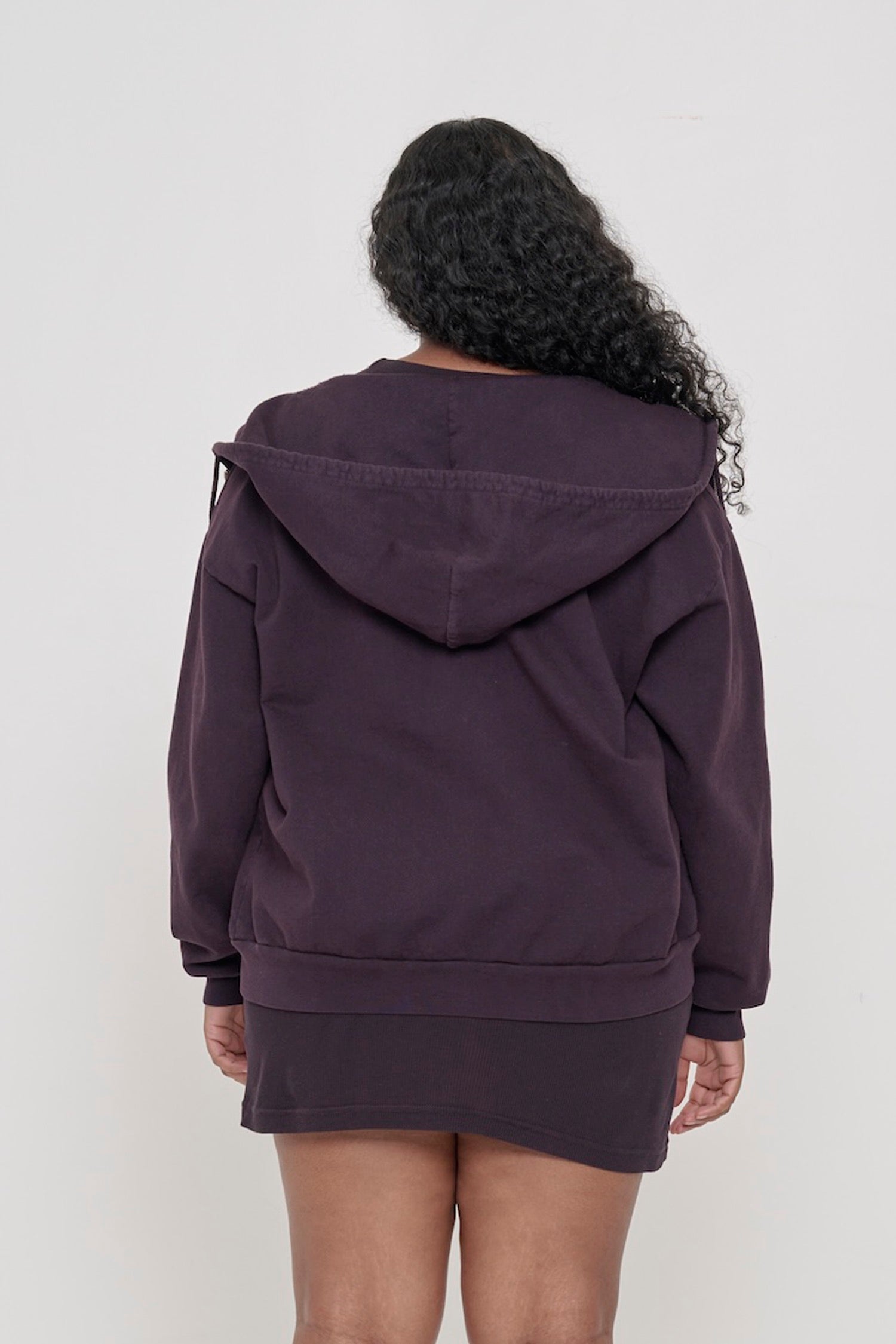 Back view of a person wearing a Mulberry Trash Zip Up Hoodie, highlighting the hood.