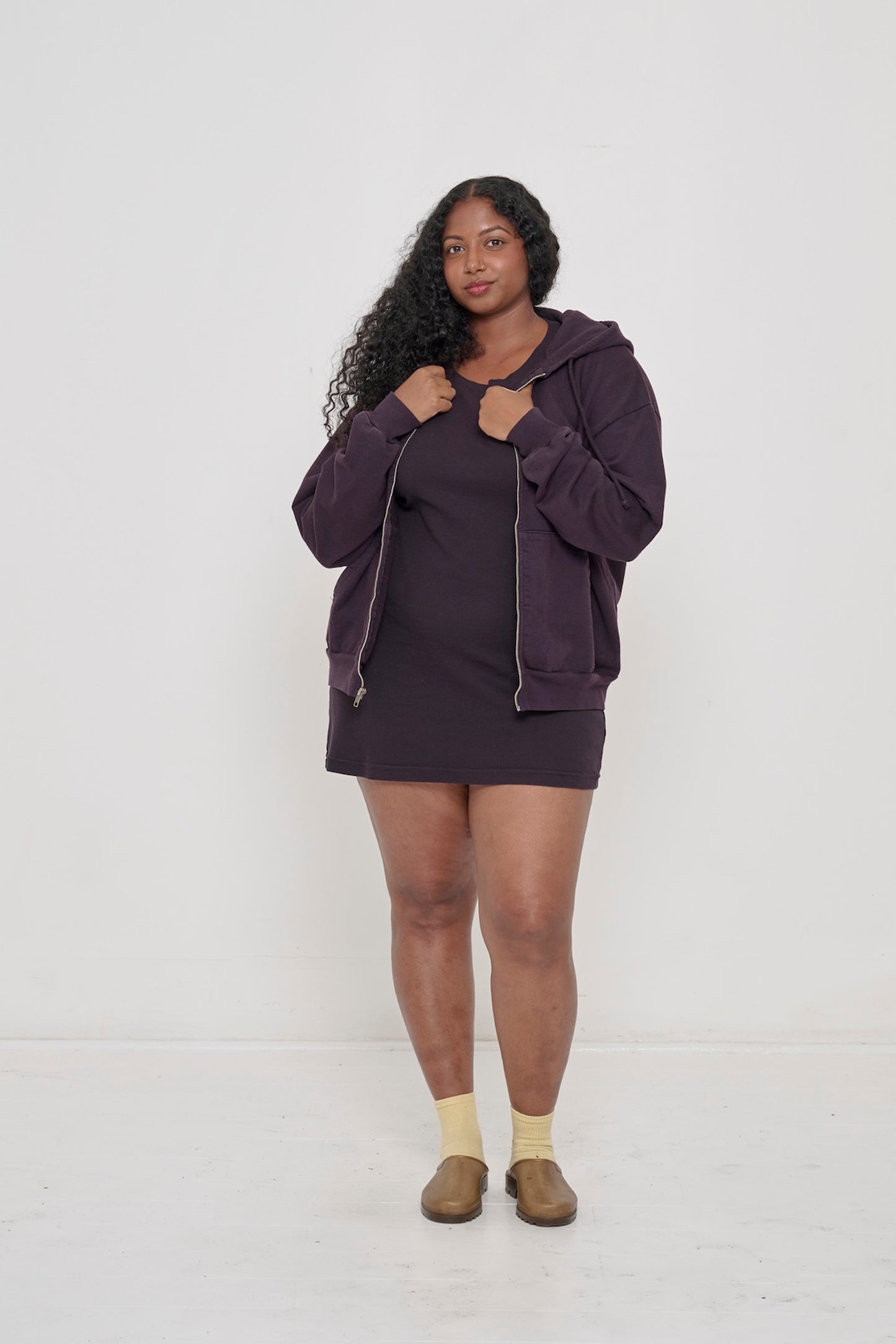 Person wearing Mulberry Trash Zip Up Hoodie unzipped with Mulberry Rib Dress.