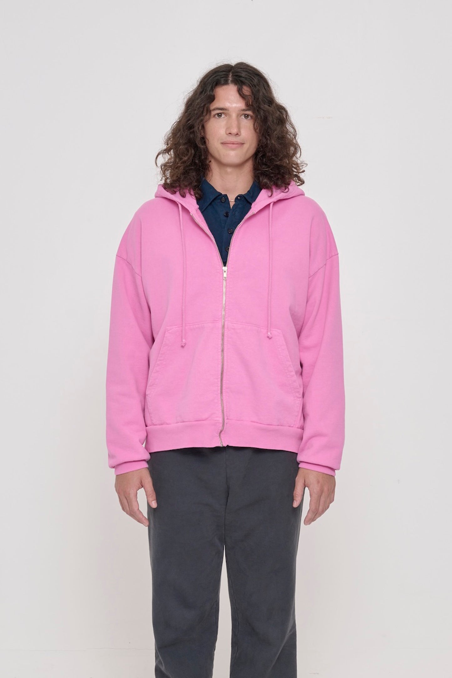 Front view of a person wearing Pixie Trash Zip Up Hoodie. Hem hits mid hip.