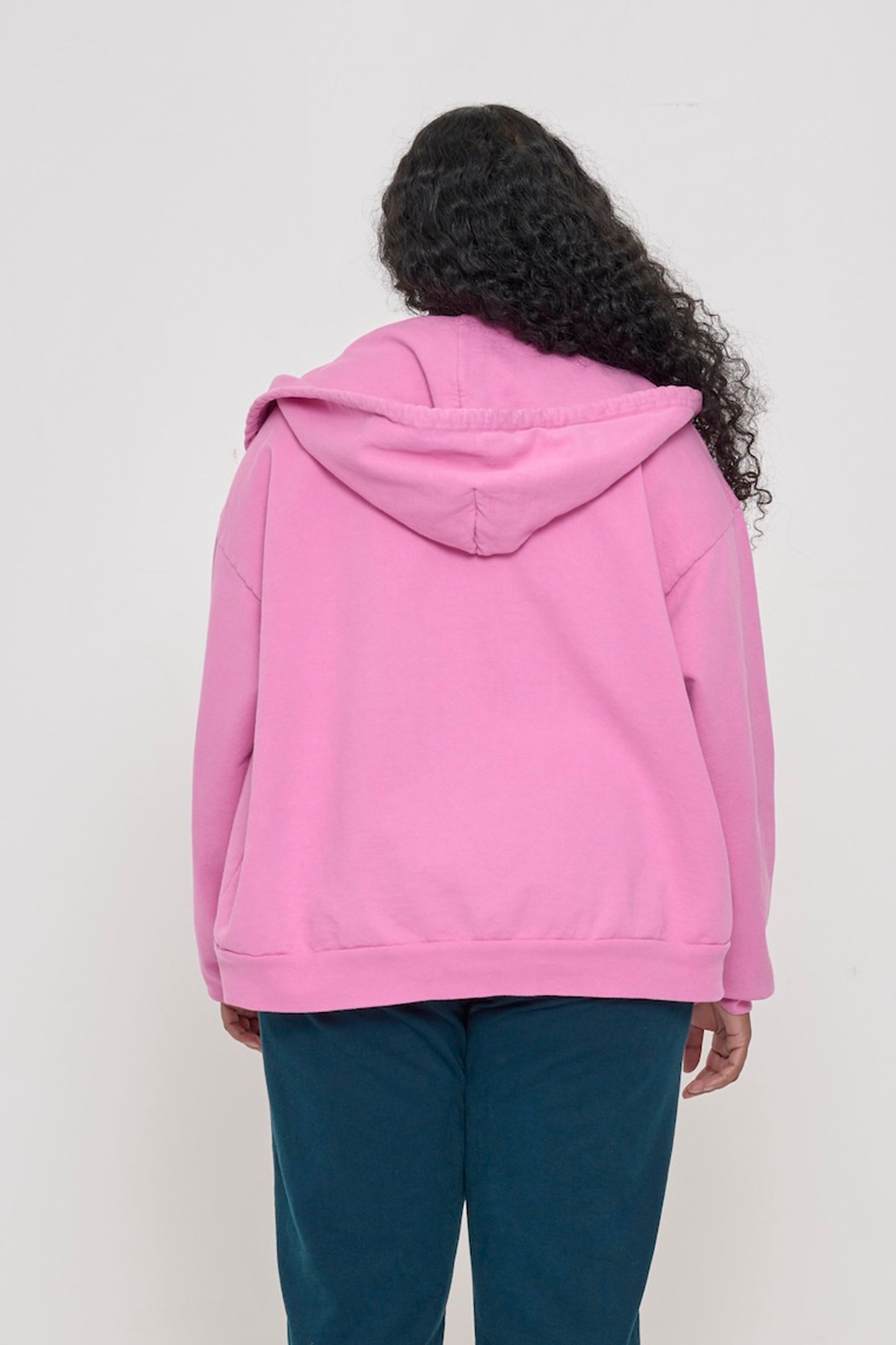 Back view of a person wearing a Pixie Trash Zip Up Hoodie, highlighting the hood.