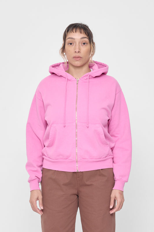 A 5'4" person wearing a size XS Pixie Trash Zip Up Hoodie. Hem hits mid hip.