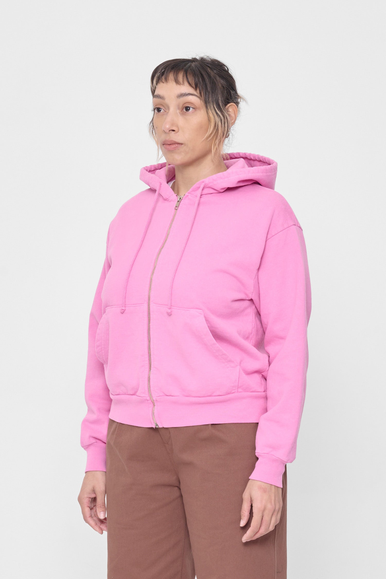 Person facing 45-degrees, showcasing sleeve's relaxed fit and drop shoulder.