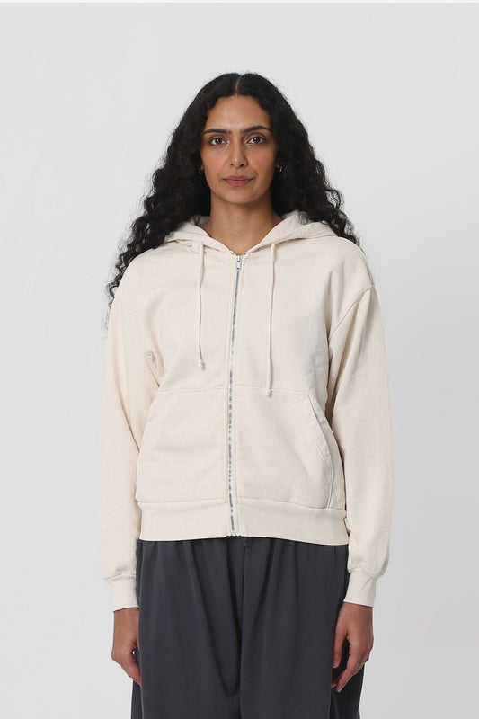 5'10" woman in a size XS Scour Trash Zip Up Hoodie. Hem hits her upper-middle hip.