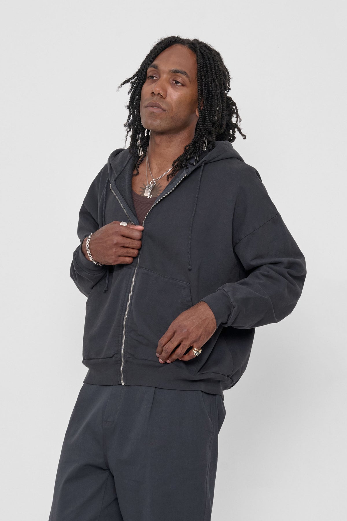 Trash Zip Up Hoodie in Slate – front view on model, styled with matching Life Uniform Pants and Plasticana shoes