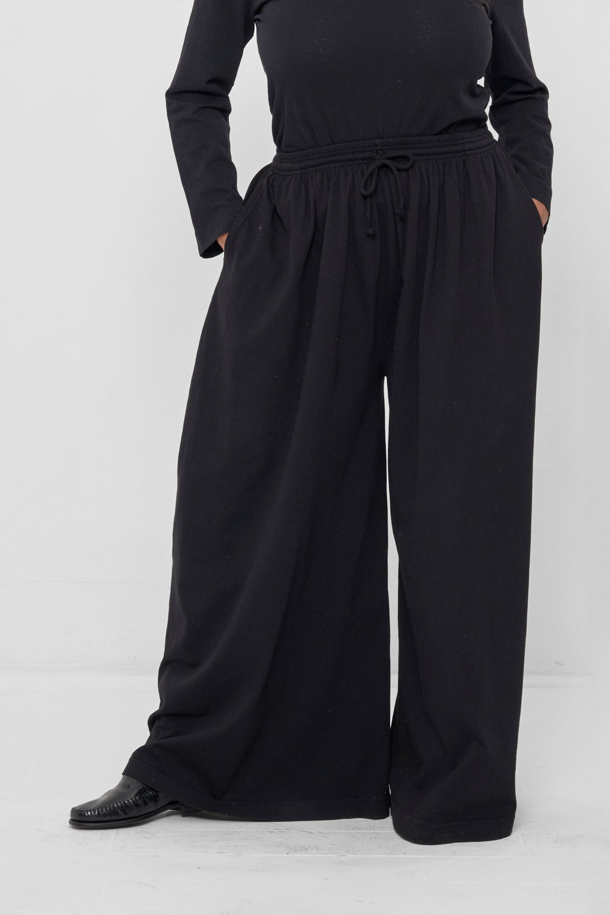 Tubular Pants in Black – front view on model