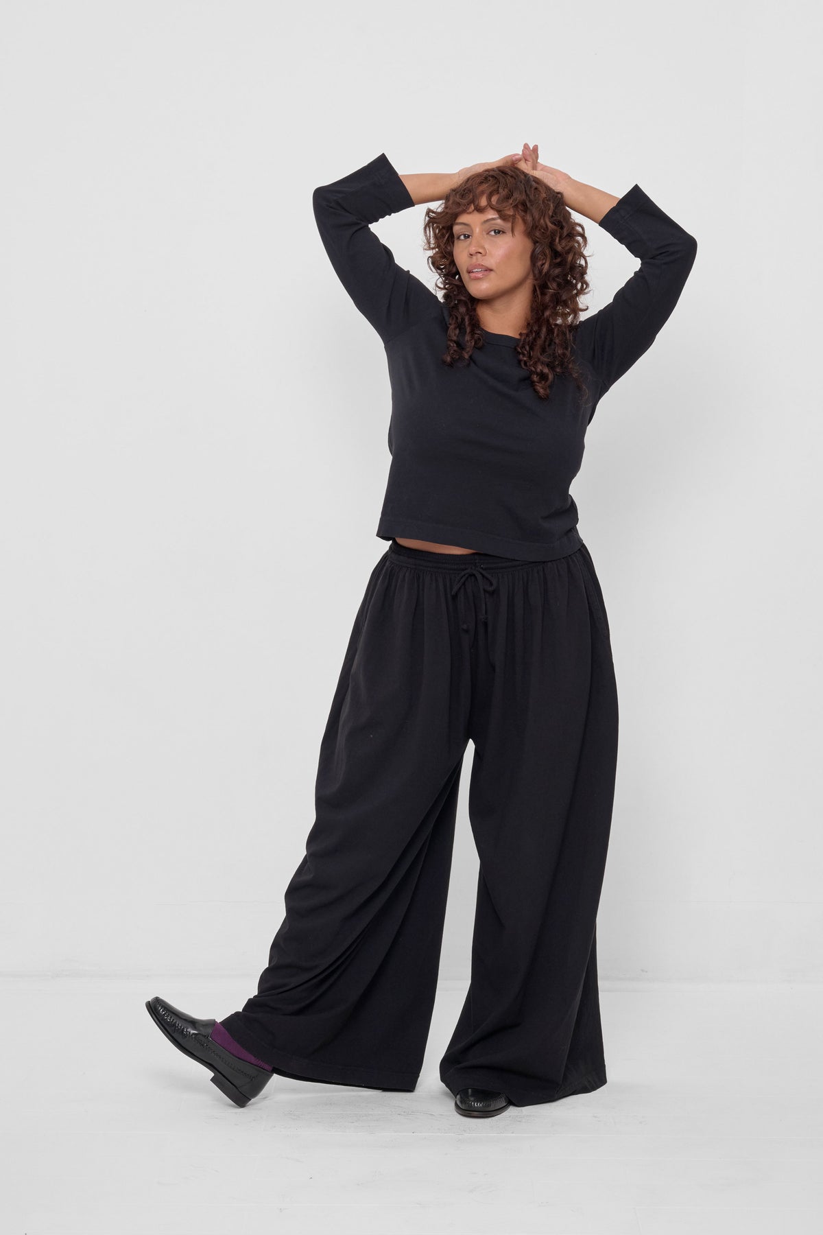 Tubular Pants in Black – full body view on model, styled with Black Straight Sleeve Tailored Trash Tee