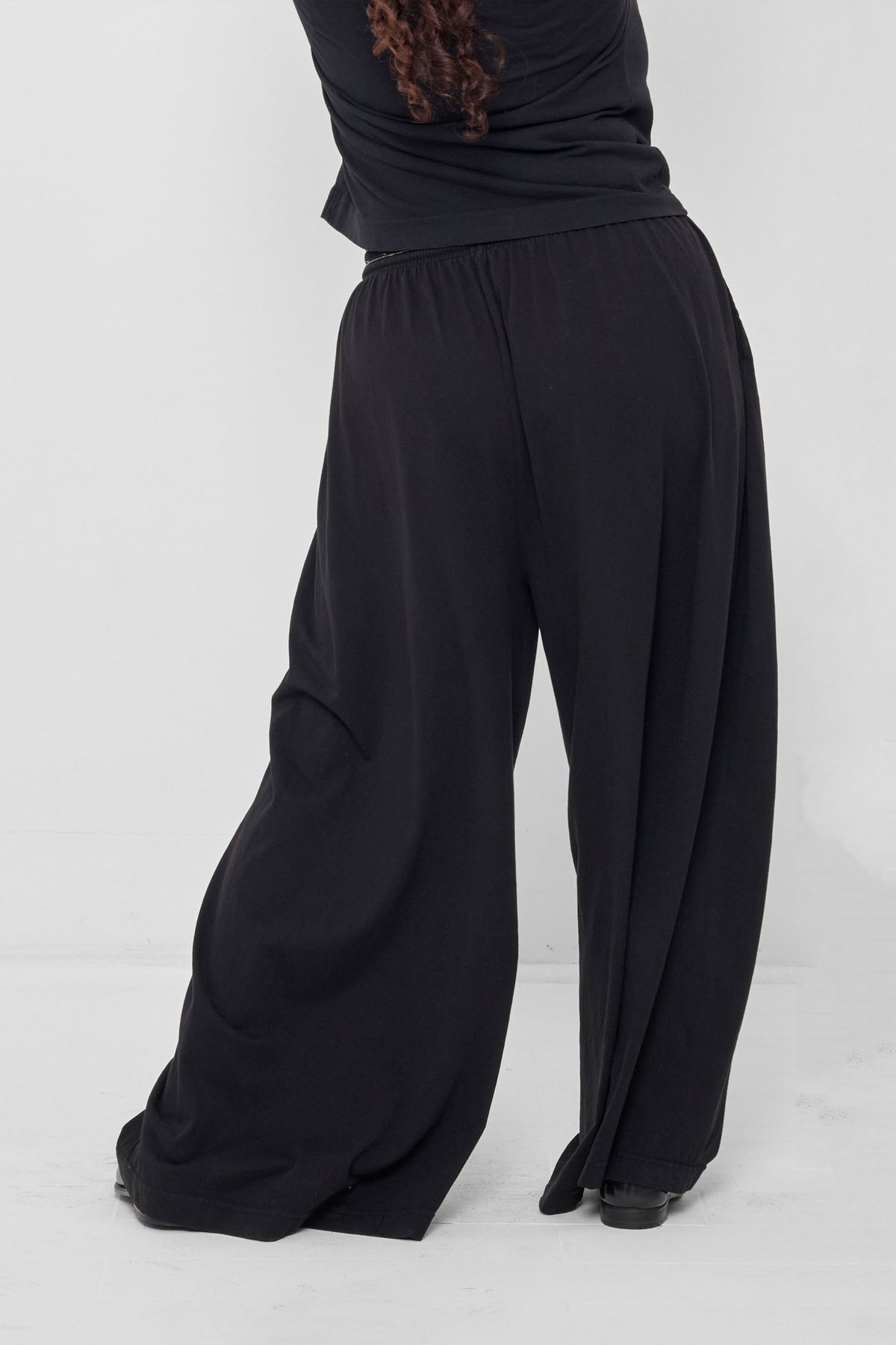 Tubular Pants in Black – back view on model