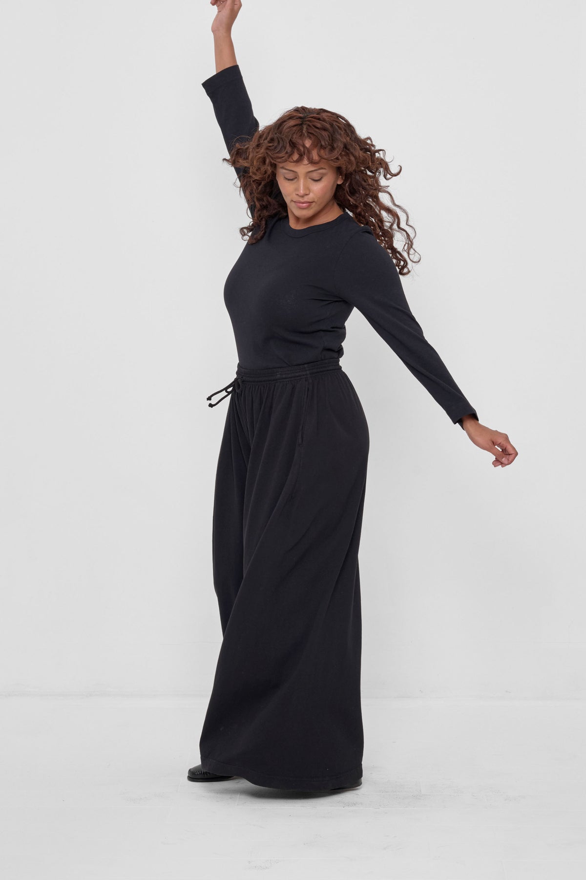 Tubular Pants in Black – full body view on model, styled with Black Straight Sleeve Tailored Trash Tee