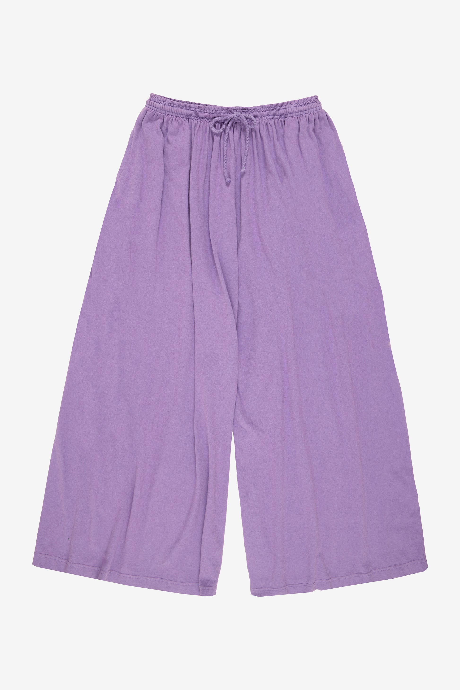 Flat lay: pant legs smoothed out, showing pant leg opening is as wide as the waistband.