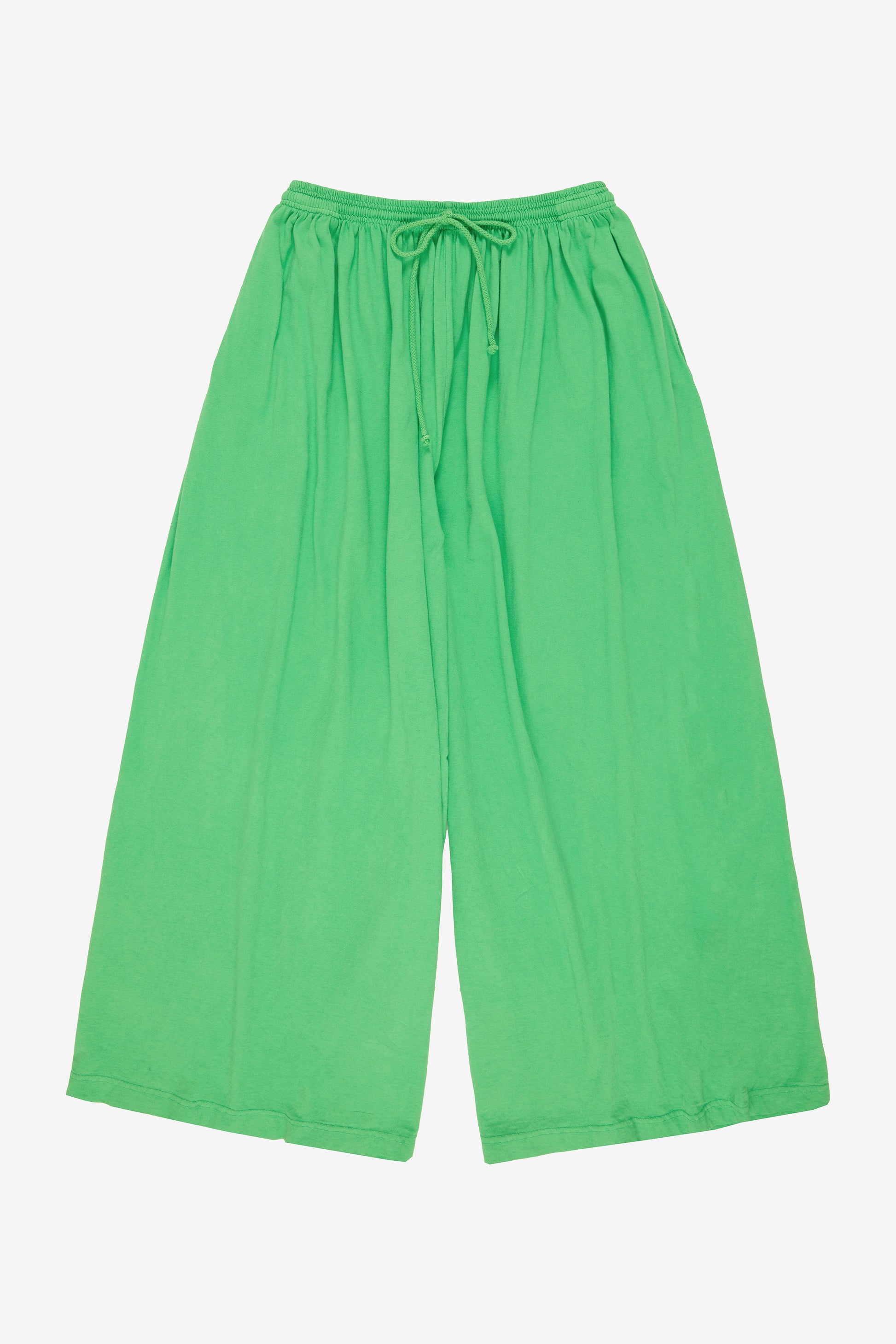 Flat lay: pant legs smoothed out, showing pant leg opening is as wide as the waistband.