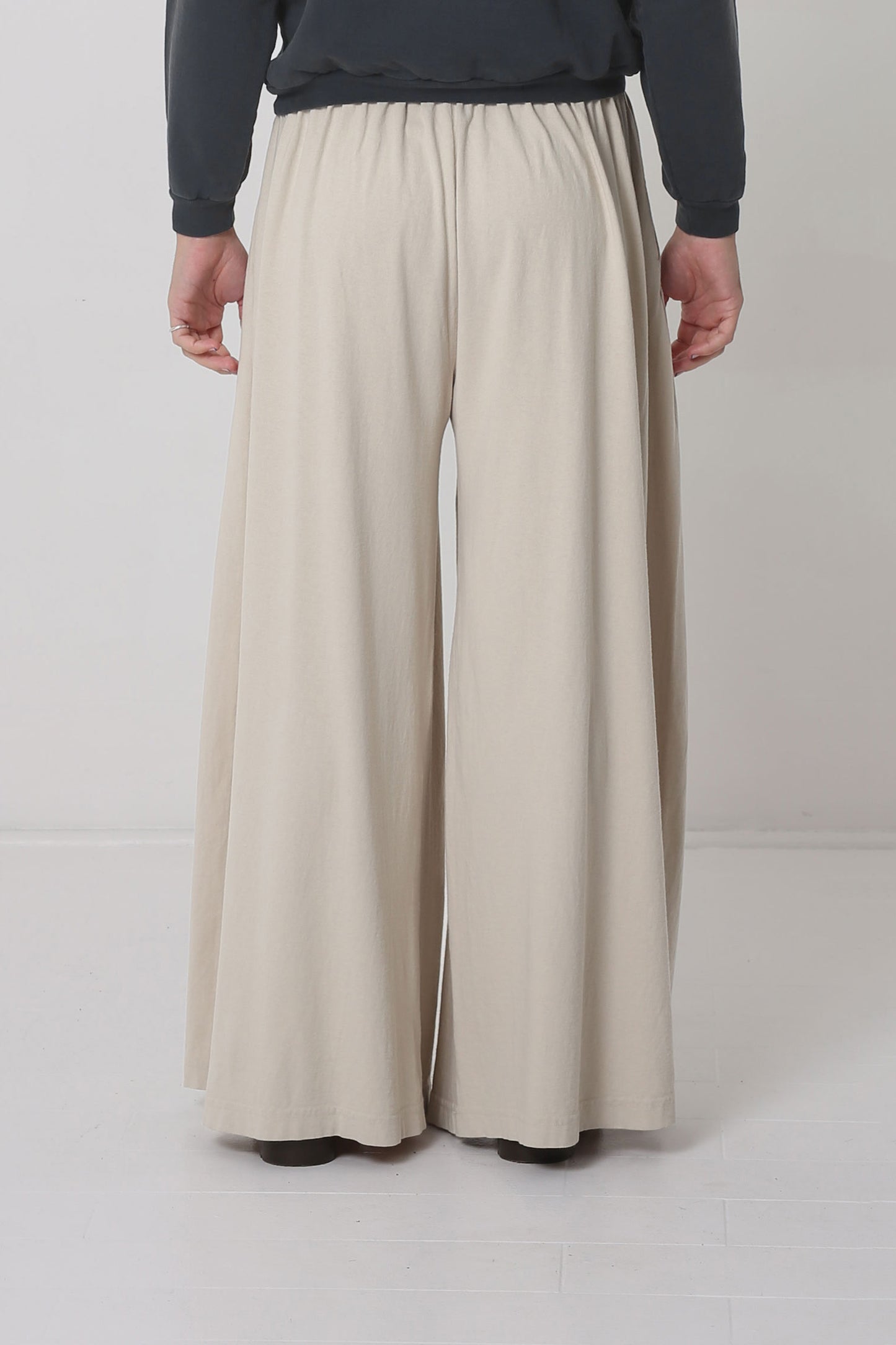 Back shows hem just below the model's heels.