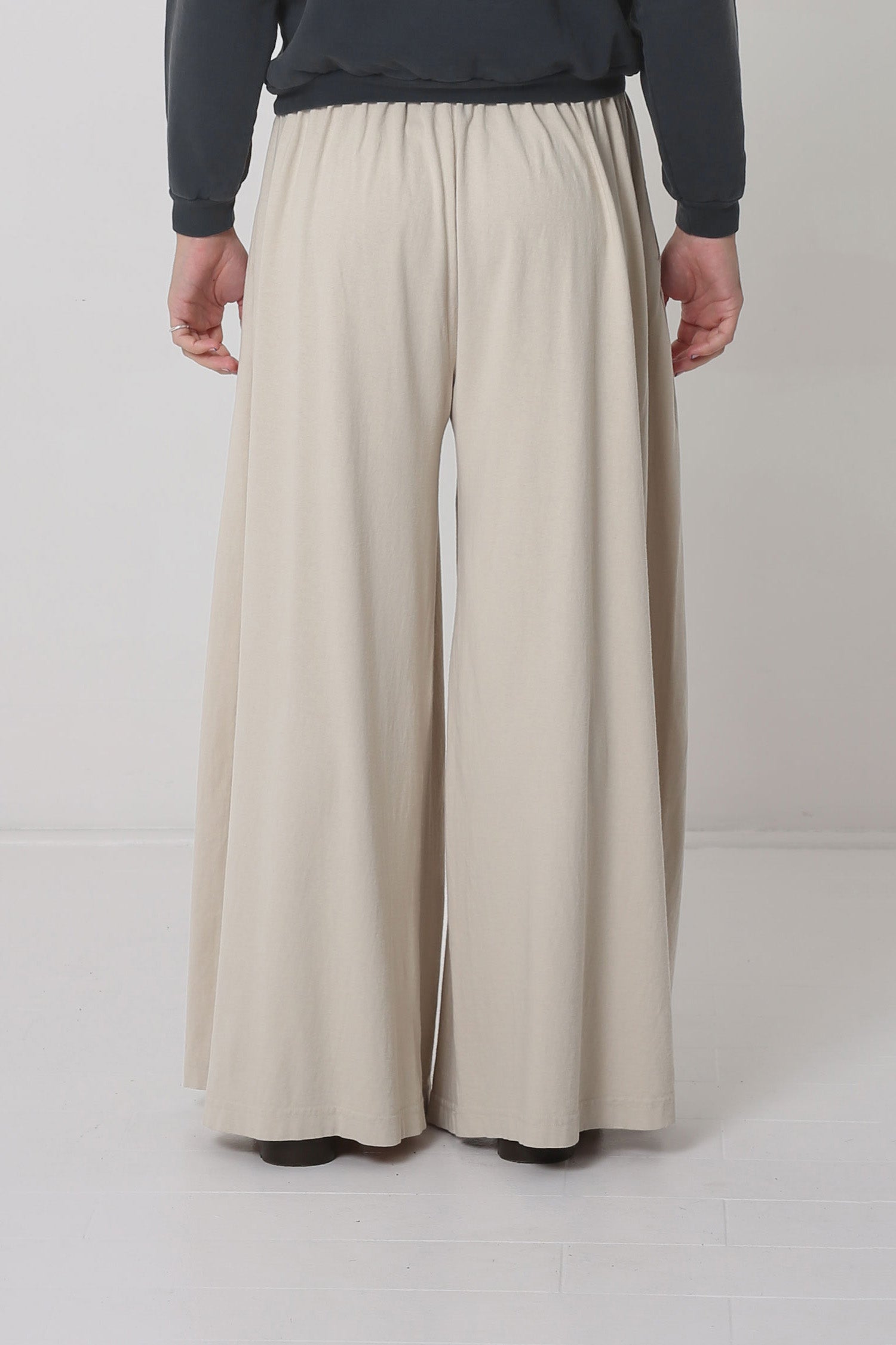 Back shows hem just below the model's heels.