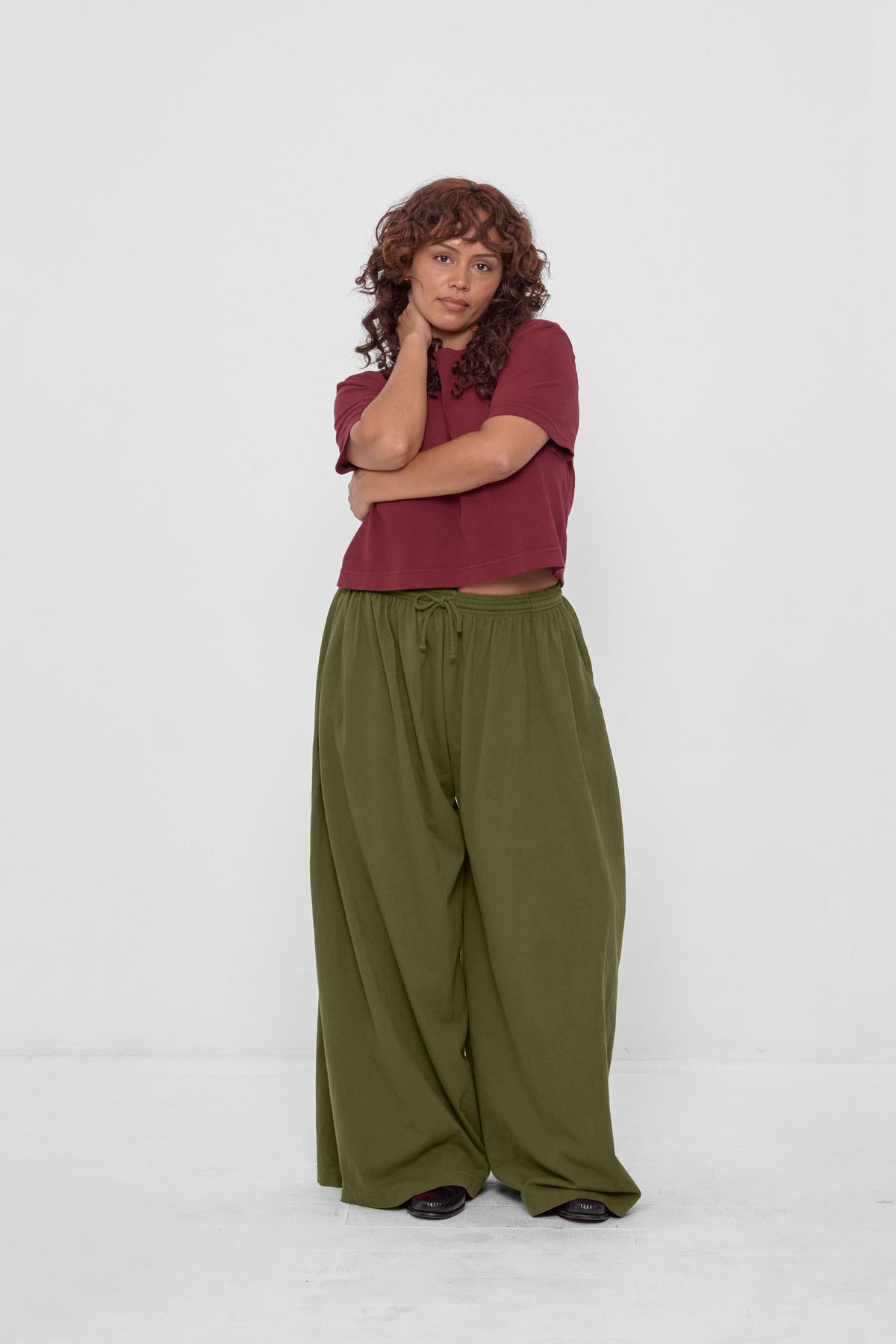 Tubular Pants in Olive – front view on model, styled with Garnet Baby Trash Tee