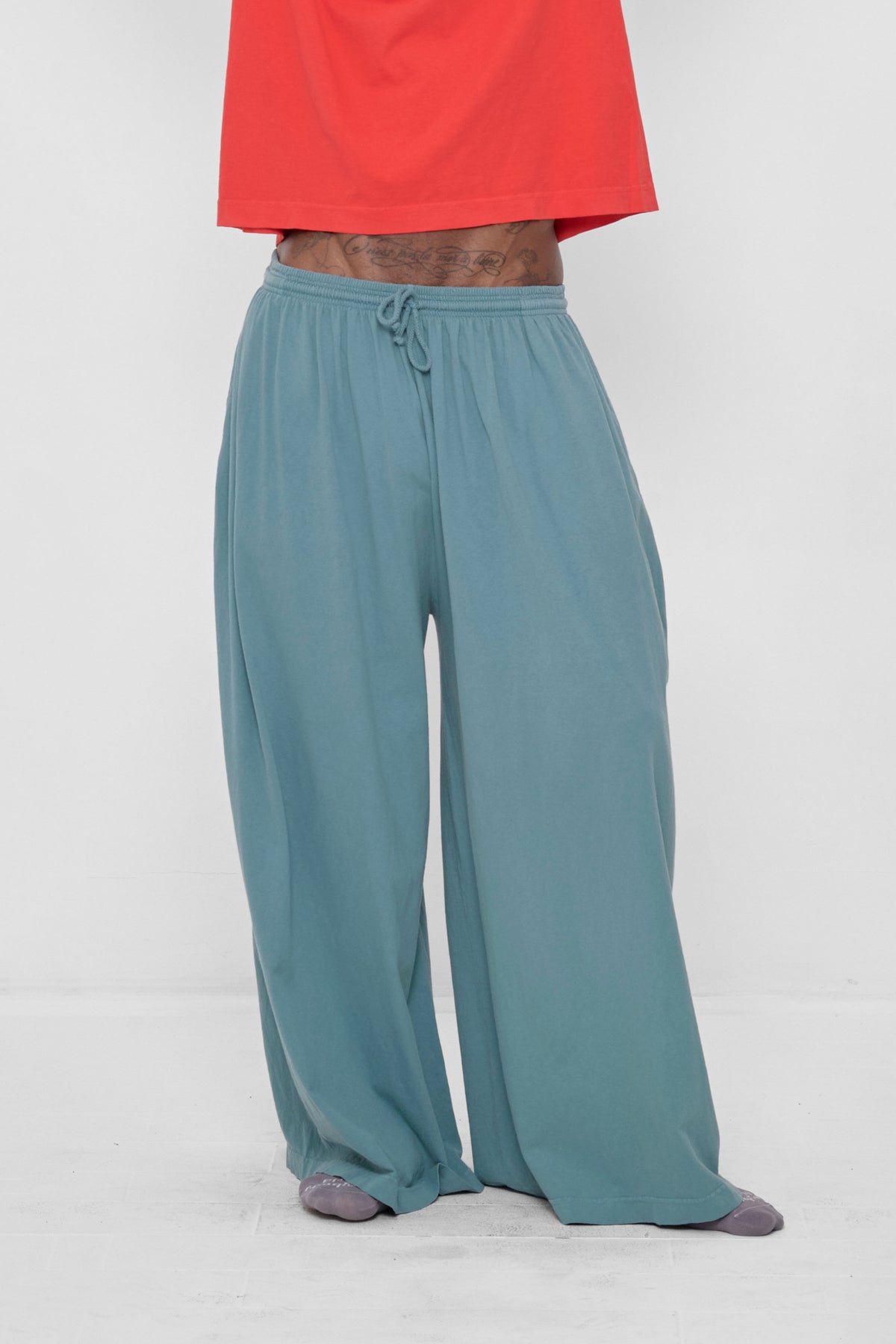 Tubular Pants in Garnet – front view on model