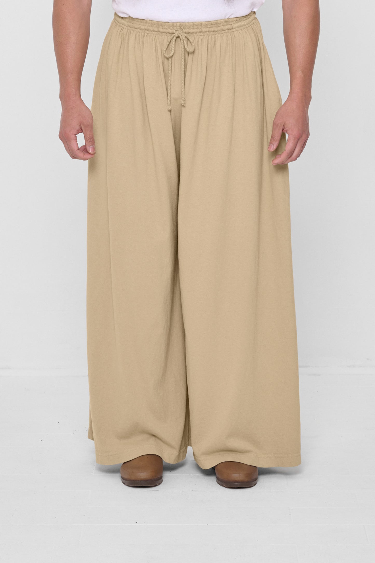 Waist down front view of Sand Storm Tubular Pants on 5'11" model.