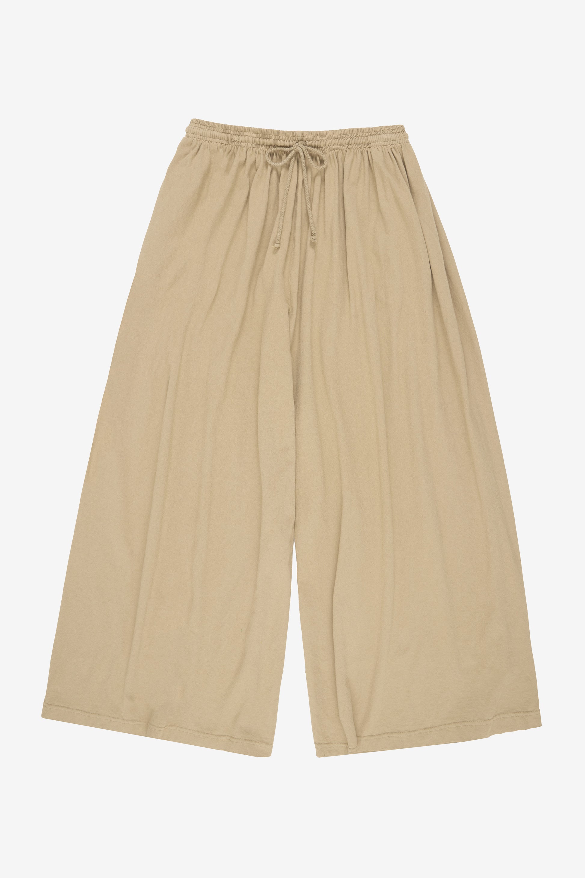 Flat lay: pant legs smoothed out, showing pant leg opening is as wide as the waistband.