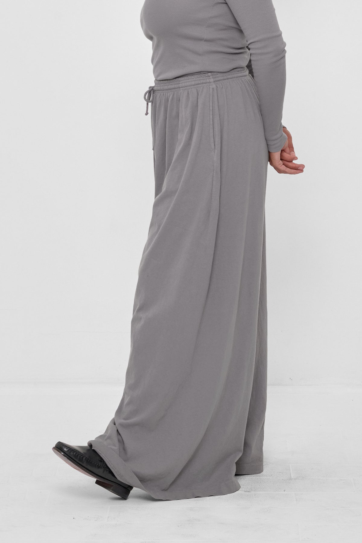 Tubular Pants in Stone – side view on model