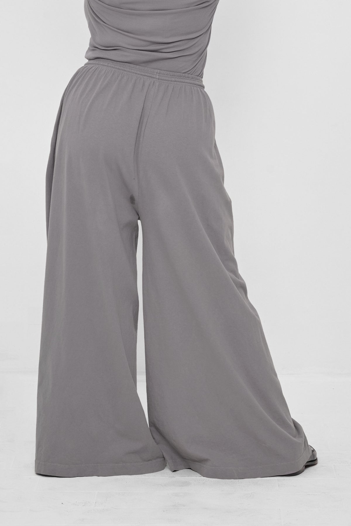 Tubular Pants in Stone – back view on model