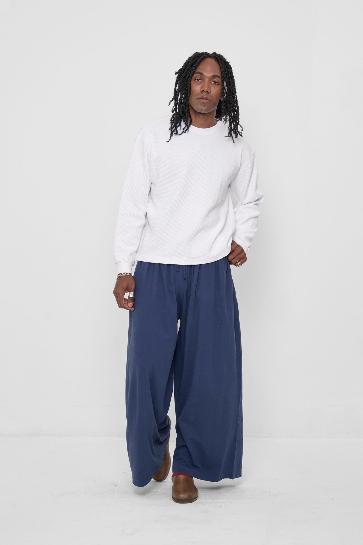 Tubular Pants in Washed Navy – front view on model, styled with a White Thermal Long Sleeve Boxier Trash Tee