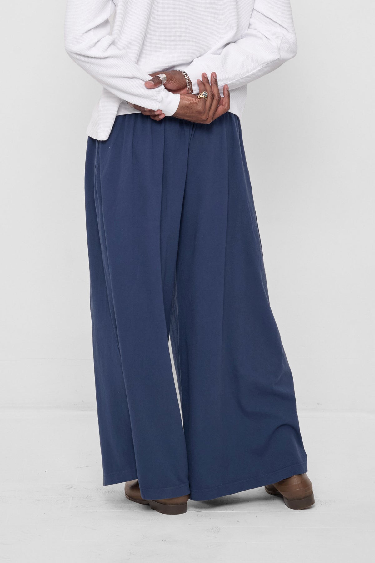 Tubular Pants in Washed Navy – front view on model, layered over a White Rib Long Sleeve