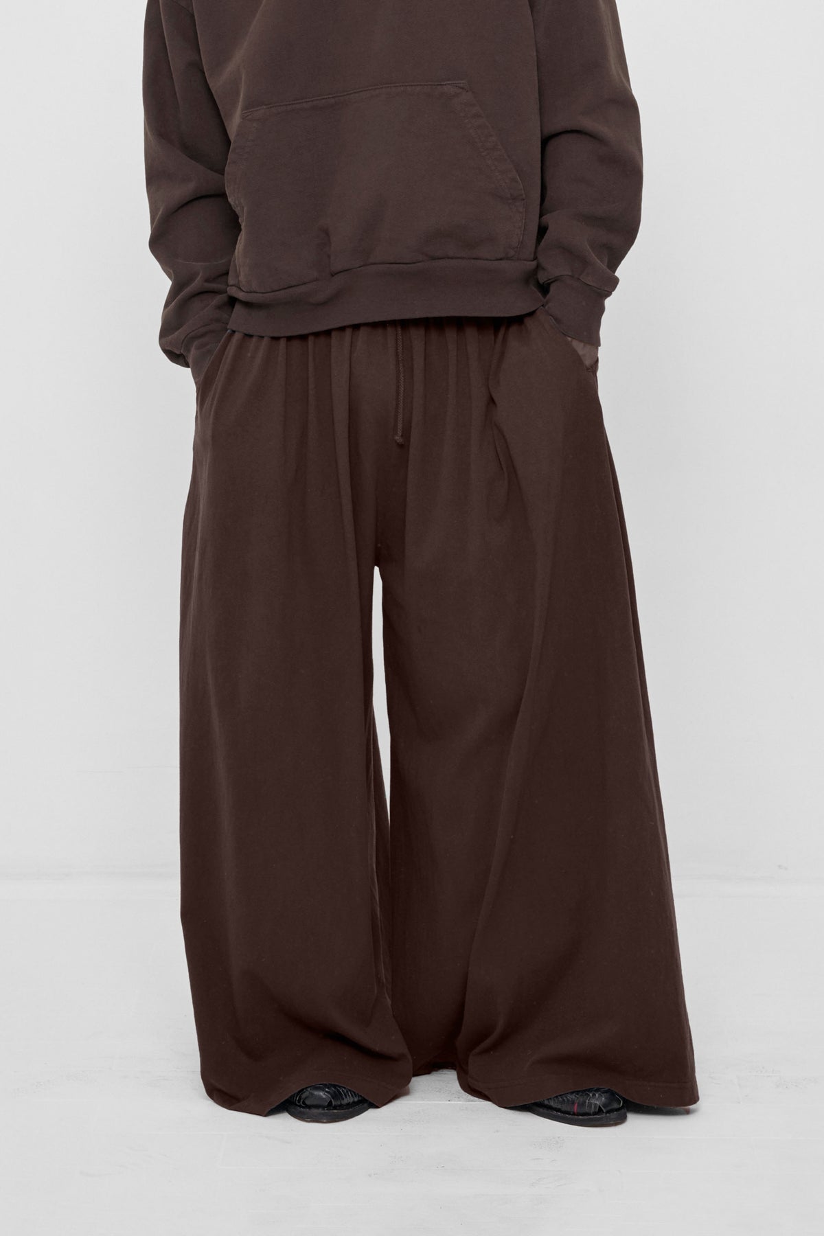 Tubular Pants in Wet Soil – front view on model