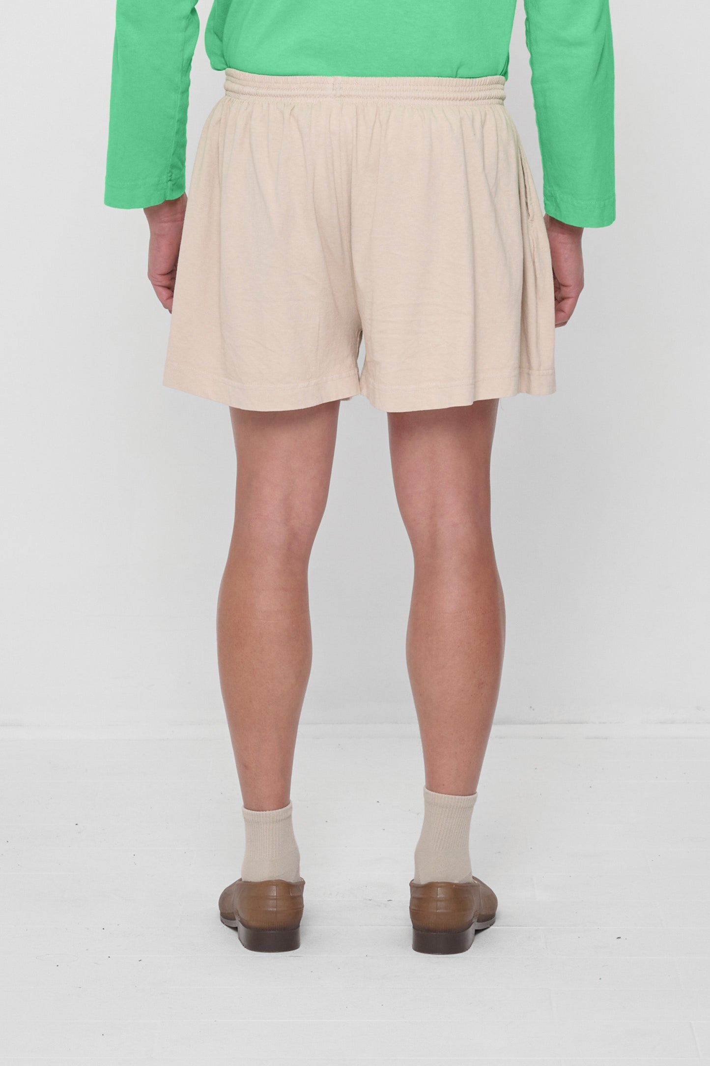 Back view: gathers at the waist create drape.