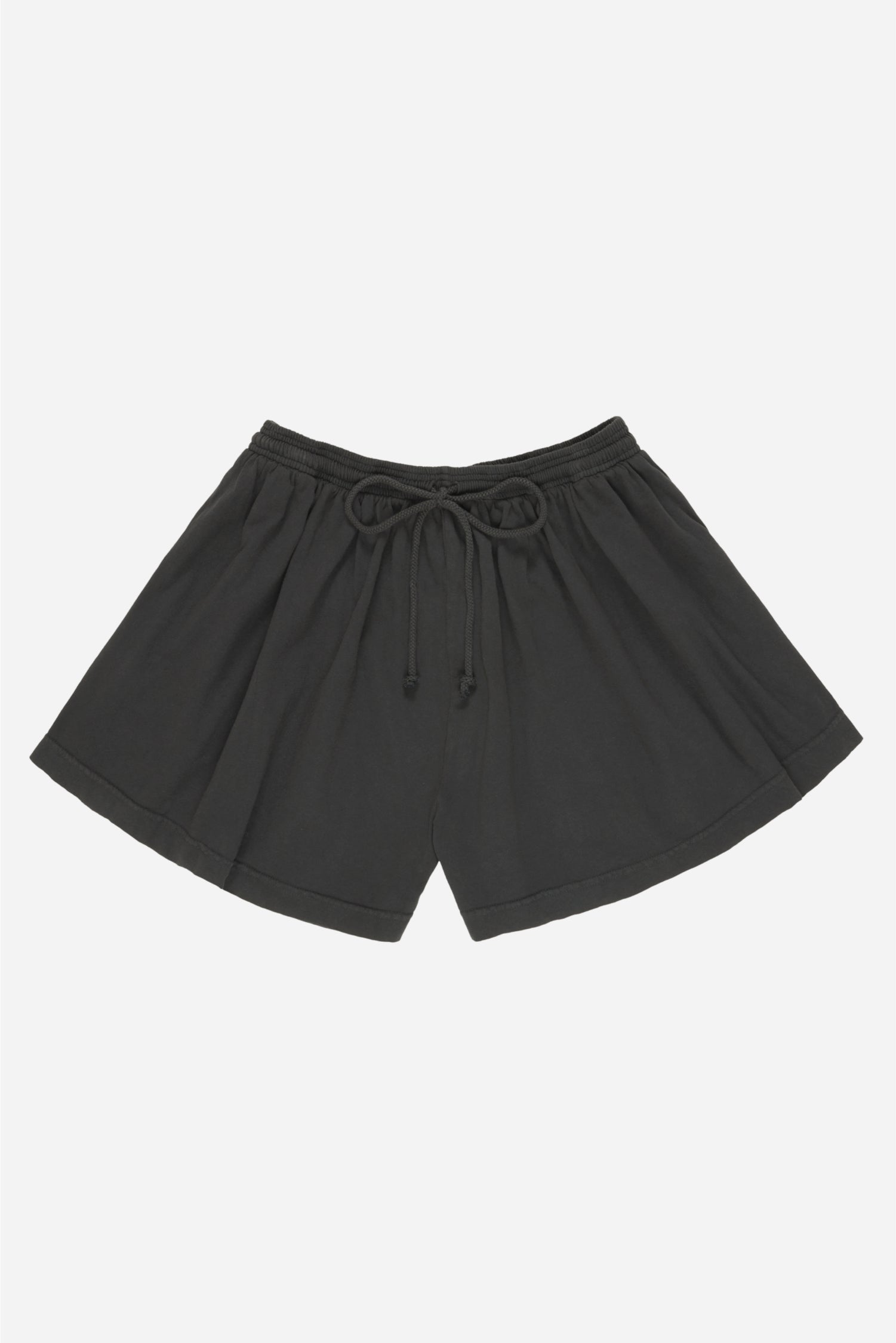Flat lay of Slate Tubular Shorts shows tied waistband drawcord, wide leg openings and high-low hem.