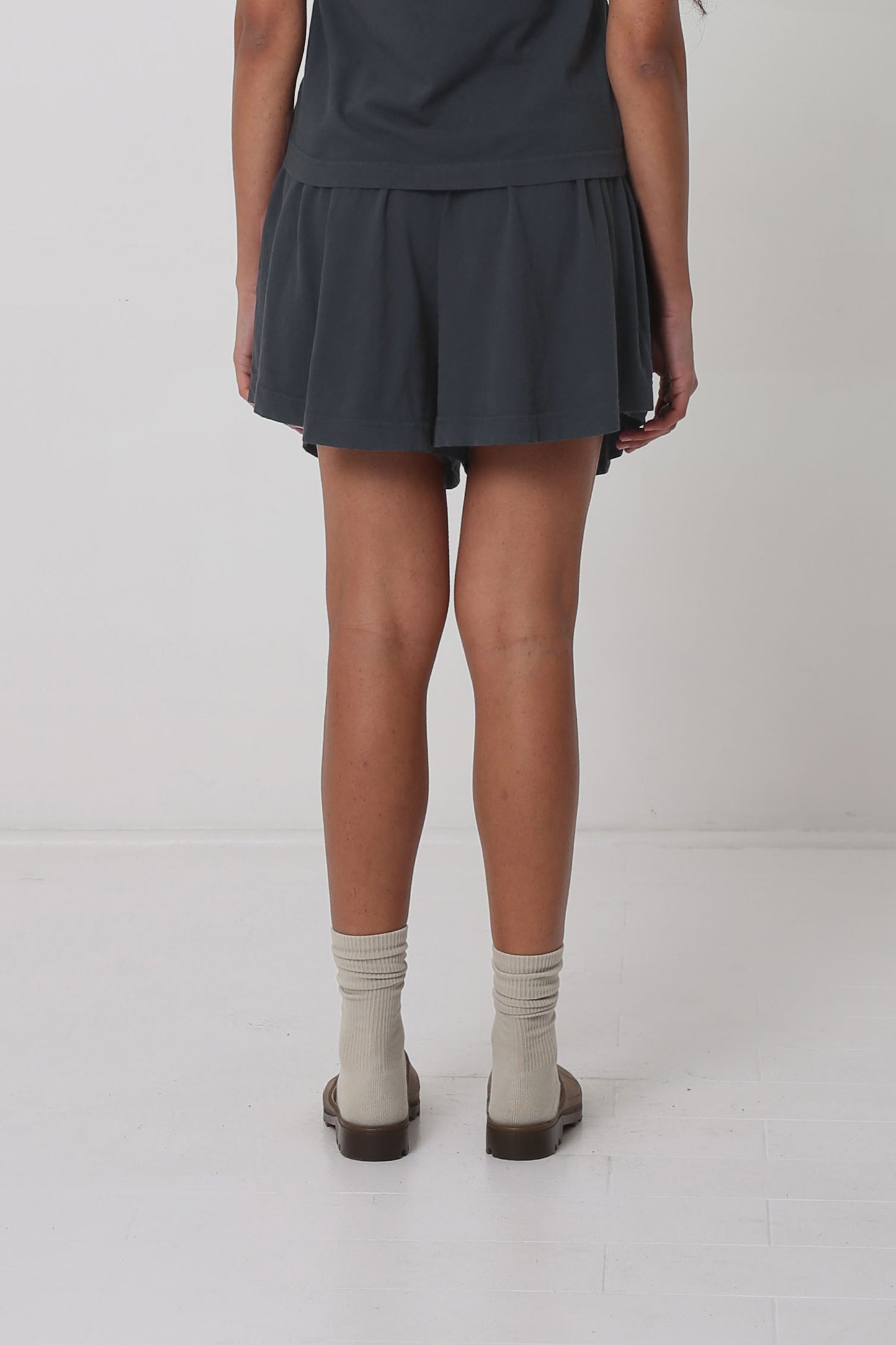 Back view: gathers at the waist create drape.